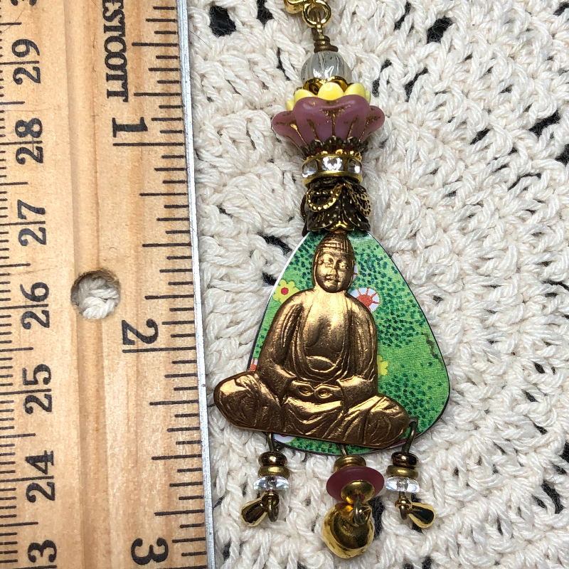 buddha in the spring flowers vintage tin necklace pendant