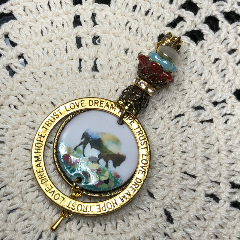 lineage of buffalo, enameled necklace pendant