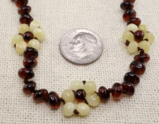 <u>Baltic Amber Adult/Adolescent Necklace - Polished White Flower</u>