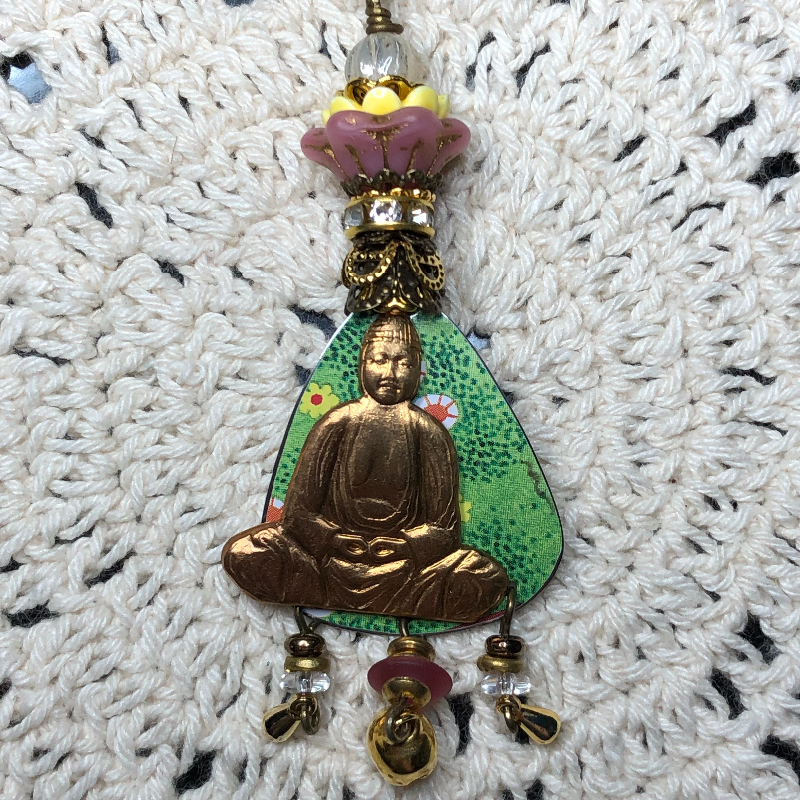 buddha in the spring flowers vintage tin necklace pendant
