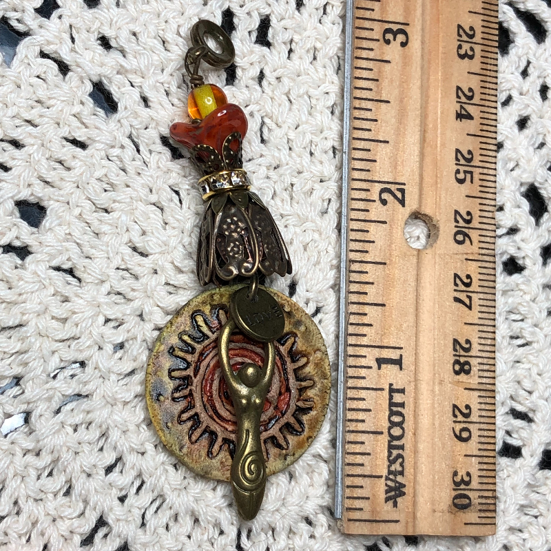 sun centered goddess kiln fired necklace pendant