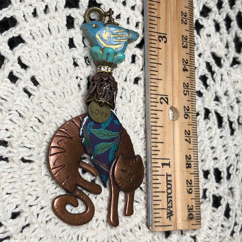 bronze cat, purple/green leaf, blue bird necklace pendant