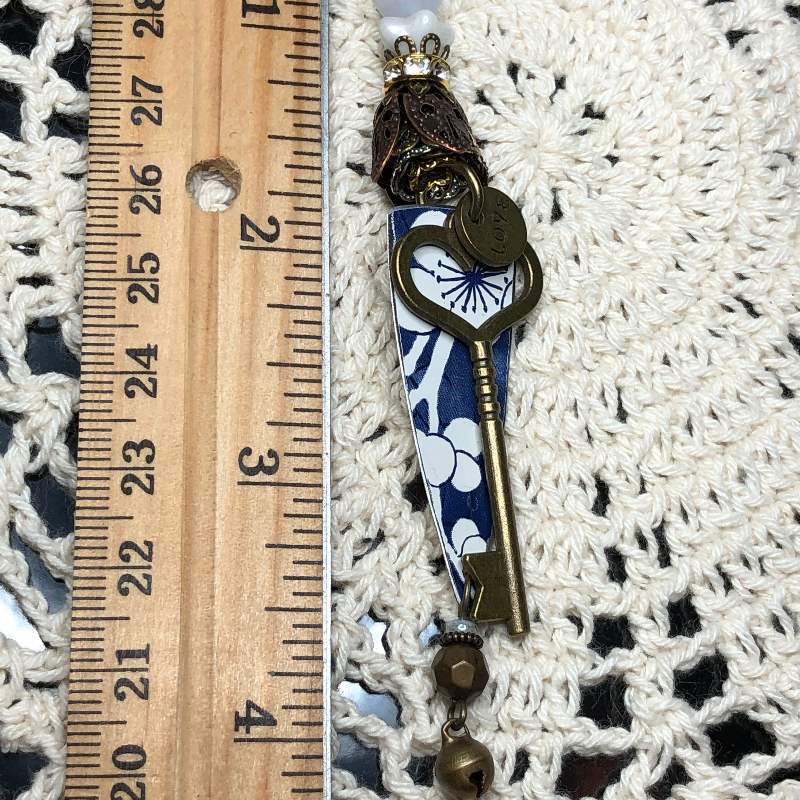 key to the white flower garden vintage tin necklace pendant