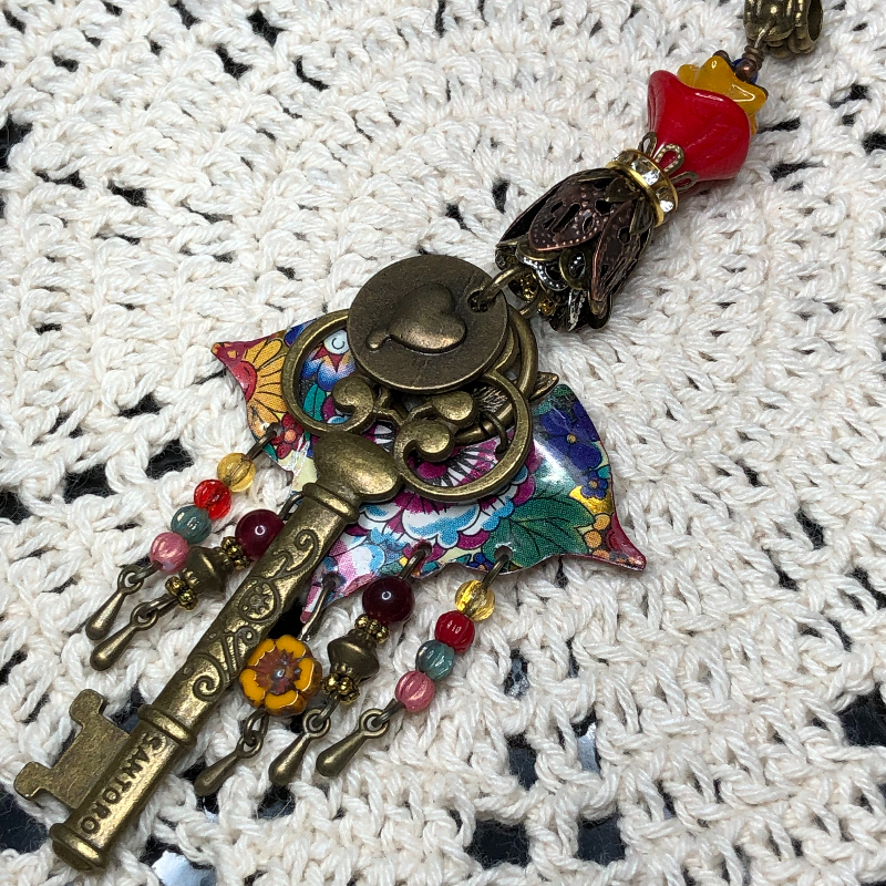if jerry garcia had a key-vintage hippie tin necklace pendant