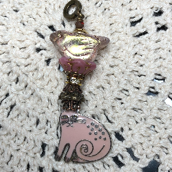 pink enameled cat, glowing bird two, necklace pendant