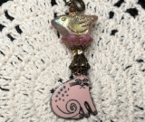 pink enameled cat, glowing bird necklace pendant