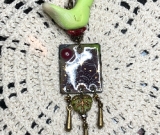 sacred flight, enameled burgundy flower enameled necklace pendant